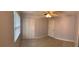 Bedroom featuring a closet with bi-fold doors, a ceiling fan, and tiled floors at 5729 13Th St, Zephyrhills, FL 33542