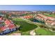 Scenic aerial shot of a residential community with golf course, ponds, and a bridge in the background at 6105 Mirada Cir, St Petersburg, FL 33715