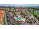 Stunning aerial view of a community with a pool, residences, and a golf course, framed by the ocean at 6105 Mirada Cir, St Petersburg, FL 33715