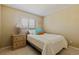 Neutral bedroom with a comfy bed, natural light, and simple decor at 6105 Mirada Cir, St Petersburg, FL 33715