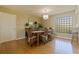 Elegant dining room featuring hardwood floors, a modern chandelier, and a stylish dining set at 6105 Mirada Cir, St Petersburg, FL 33715