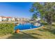 Scenic view of the neighborhood pond with lush landscaping and vibrant reflections at 6105 Mirada Cir, St Petersburg, FL 33715