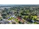 Aerial view of the neighborhood highlighting lush greenery, nearby lake, and beautiful single-Gathering homes at 6121 38Th W Ave, Bradenton, FL 34209