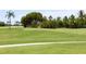 Beautiful golf course with lush green fairway surrounded by mature trees and landscaping at 6121 38Th W Ave, Bradenton, FL 34209