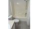 Standard bathroom features a tub and shower combination with a tile surround at 6439 Cypressdale Dr # 202, Riverview, FL 33578