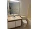 Standard bathroom featuring a sink, toilet, and a mirror over the vanity at 6439 Cypressdale Dr # 202, Riverview, FL 33578