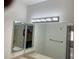 Spacious bathroom featuring vanity with a large mirror and overhead lighting at 6439 Cypressdale Dr # 202, Riverview, FL 33578