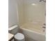 Bathroom features a tub and shower combination with a toilet and vanity at 6439 Cypressdale Dr # 202, Riverview, FL 33578