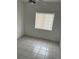 Empty bedroom with neutral tile flooring and a window at 6439 Cypressdale Dr # 202, Riverview, FL 33578