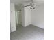 Empty bedroom featuring tile flooring and a ceiling fan at 6439 Cypressdale Dr # 202, Riverview, FL 33578