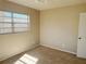 Cozy bedroom featuring neutral walls, carpeted floor, and ample natural light at 6601 65Th N Way, Pinellas Park, FL 33781