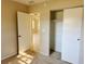 Bedroom featuring neutral walls, carpeted floor, and closet with sliding doors at 6601 65Th N Way, Pinellas Park, FL 33781