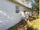 Exterior view of a property's side with an air conditioning unit at 6601 65Th N Way, Pinellas Park, FL 33781