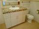 Bathroom featuring vanity with colorful tiled countertop and a toilet at 7000 Beach Plz # 805, St Pete Beach, FL 33706