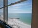 Ocean and beach view from condo window with blue skies and white clouds at 7000 Beach Plz # 805, St Pete Beach, FL 33706