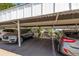 Assigned carport parking with mature landscaping, conveniently located near building at 7300 Sunshine Skyway S Ln # 202, St Petersburg, FL 33711