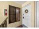 The condo's entrance features a welcoming door with a decorative wreath and secure lock system at 7300 Sunshine Skyway S Ln # 202, St Petersburg, FL 33711