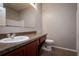 Bathroom showcasing a sink with granite countertop and a toilet in a neutral-toned space at 7304 63Rd E Ct, Palmetto, FL 34221