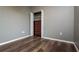 Bedroom featuring wood flooring and a closet for storage at 7304 63Rd E Ct, Palmetto, FL 34221