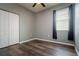 Bedroom with a closet, wood flooring, and curtains on the window at 7304 63Rd E Ct, Palmetto, FL 34221