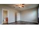 Bright bedroom with wood floors, ceiling fan, and access to a bathroom and closet at 7304 63Rd E Ct, Palmetto, FL 34221