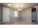 Bright dining room featuring neutral walls, tile flooring, and an elegant chandelier at 7304 63Rd E Ct, Palmetto, FL 34221