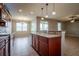 Open concept kitchen with granite countertops, stainless steel appliances, and pendant lighting at 7304 63Rd E Ct, Palmetto, FL 34221