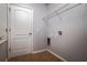 A laundry room providing ample space for chores with a wire shelf for storage at 7304 63Rd E Ct, Palmetto, FL 34221