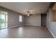 Large living room featuring tile flooring, neutral paint, and sliding glass doors to outdoor area at 7304 63Rd E Ct, Palmetto, FL 34221