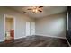 Spacious main bedroom with an ensuite bathroom, ceiling fan, and wood flooring at 7304 63Rd E Ct, Palmetto, FL 34221