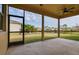 Covered patio offering an outdoor living space with views of the landscaped backyard and neighborhood at 7304 63Rd E Ct, Palmetto, FL 34221