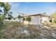 Backyard features a clothesline and could be transformed into a beautiful outdoor living space at 9121 Prosperity Ln, Port Richey, FL 34668