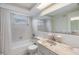 Bathroom featuring a bathtub and a marble sink at 9121 Prosperity Ln, Port Richey, FL 34668