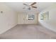 Open living area with large window and ceiling fan provides ample natural light at 9121 Prosperity Ln, Port Richey, FL 34668