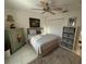 Comfortable bedroom includes closet, ceiling fan, and coordinating decor at 9337 Zamora Dr, New Port Richey, FL 34655