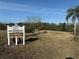 Riverside Villas welcome sign featuring Riverside Park with water backdrop at 9337 Zamora Dr, New Port Richey, FL 34655