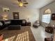 Bright living room featuring a comfortable seating area, a ceiling fan, and tile floors at 9337 Zamora Dr, New Port Richey, FL 34655