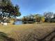 Relaxing pond view; serene atmosphere. Palm trees add to the beauty of the scenery, while benches are for enjoying at 9337 Zamora Dr, New Port Richey, FL 34655