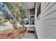 Charming front porch with a screened-in enclosure, providing a relaxing outdoor living space at 9417 Star Gazer Ln, Riverview, FL 33578