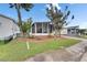 This home features a beautiful screened porch, a well manicured lawn and a brick-lined flower bed at 9417 Star Gazer Ln, Riverview, FL 33578