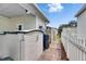 Outdoor storage shed with an adjacent walkway and fenced perimeter at 9417 Star Gazer Ln, Riverview, FL 33578