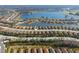 Wide aerial view of home in a community with a lake in the background at 11309 Callisia Dr, Odessa, FL 33556