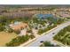 Aerial view of the community pool, clubhouse, and tennis courts at 11309 Callisia Dr, Odessa, FL 33556