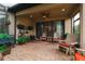 Outdoor patio area with pavers and relaxing seating area with a ceiling fan at 11309 Callisia Dr, Odessa, FL 33556