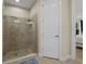 Modern walk-in shower featuring glass enclosure and a stylish tile accent wall at 11309 Callisia Dr, Odessa, FL 33556