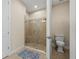 Spacious walk-in shower with glass door and decorative tile accents at 11309 Callisia Dr, Odessa, FL 33556