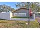 The Oak Park Villas community sign featuring a manicured landscape, accent plants, and a well-maintained exterior at 11356 94Th St, Largo, FL 33773