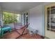 Relaxing front porch with a cozy hammock, seating, and screened windows at 1155 23Rd N Ave, St Petersburg, FL 33704