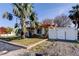 Charming single story home with stone veneer, tile roof, and mature palm trees in the front yard at 120 60Th Ave, St Pete Beach, FL 33706