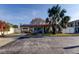 Charming single story home with stone veneer, tile roof, solar panels and a well-maintained front yard at 120 60Th Ave, St Pete Beach, FL 33706